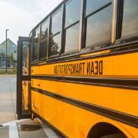 Student getting on school bus